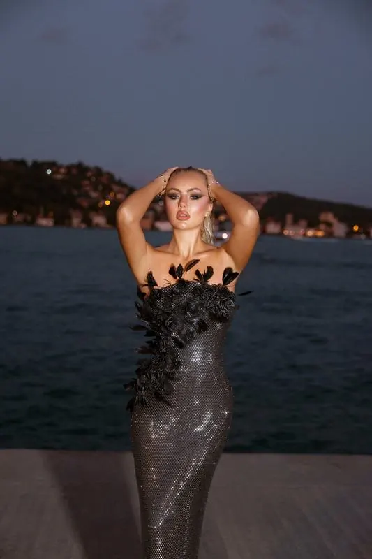 Black sequin gown on the Bosphorus at dusk