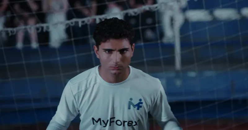 A goalkeeper staring down the striker