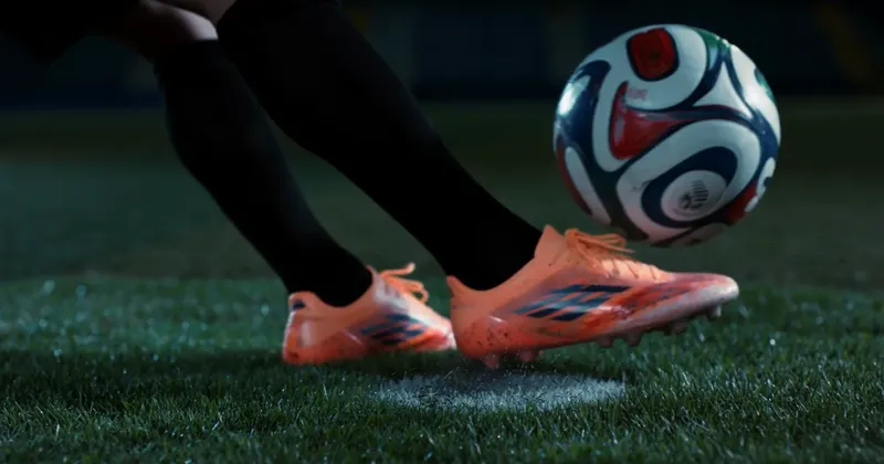 Macro shot of the boot striking the ball