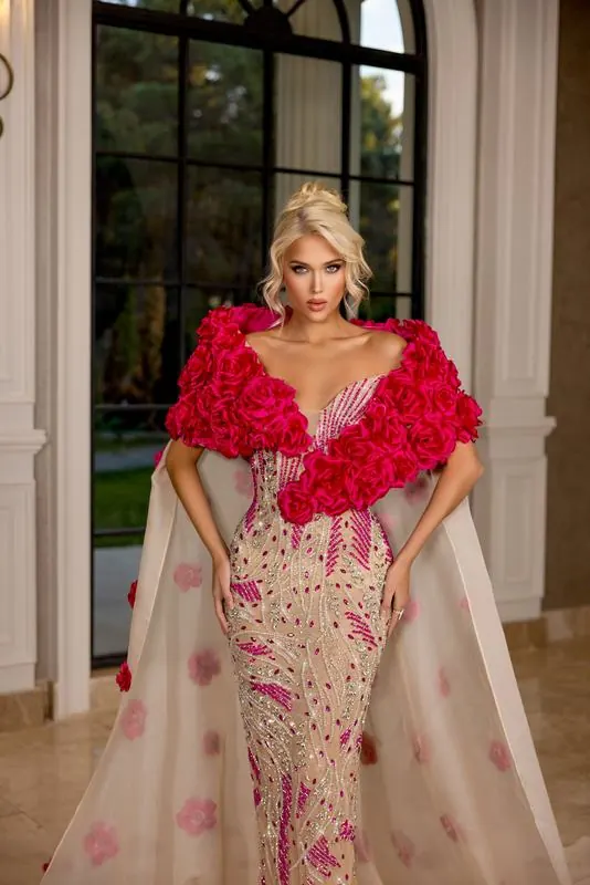 Red feathered cape over a beaded gown