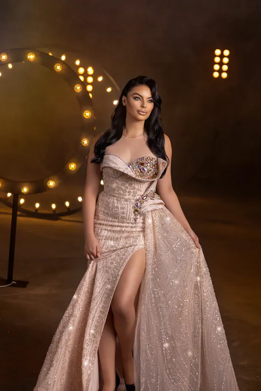 Blush sequinned gown with a slit