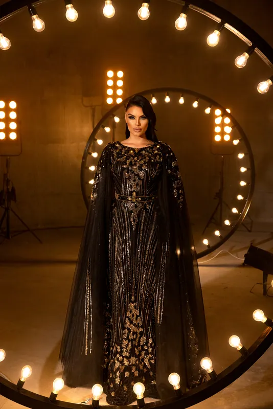 Black cape gown framed by light