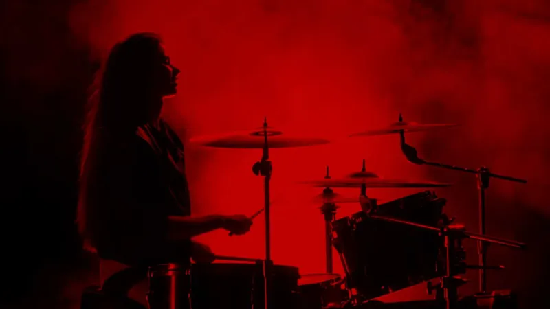 A drummer in red haze