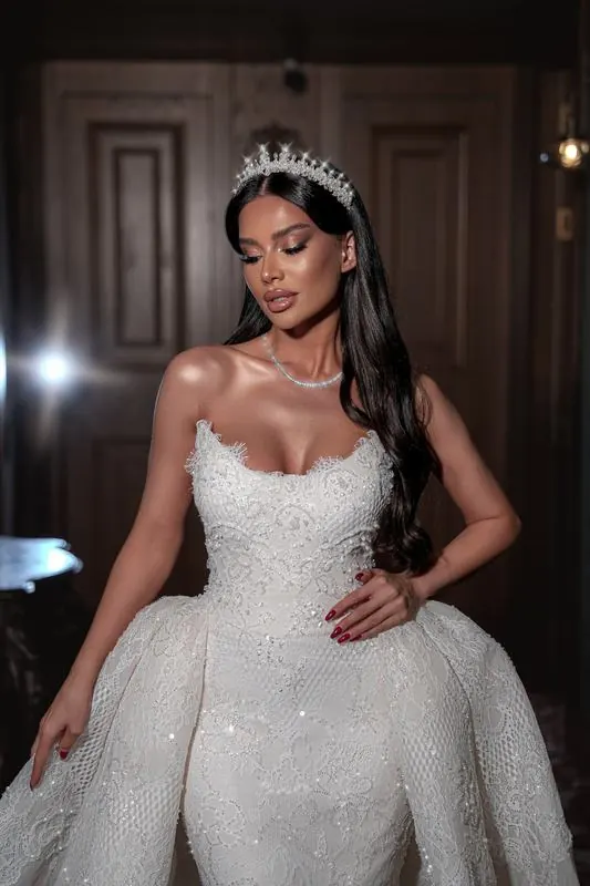 Bride with a tiara in a dark corridor