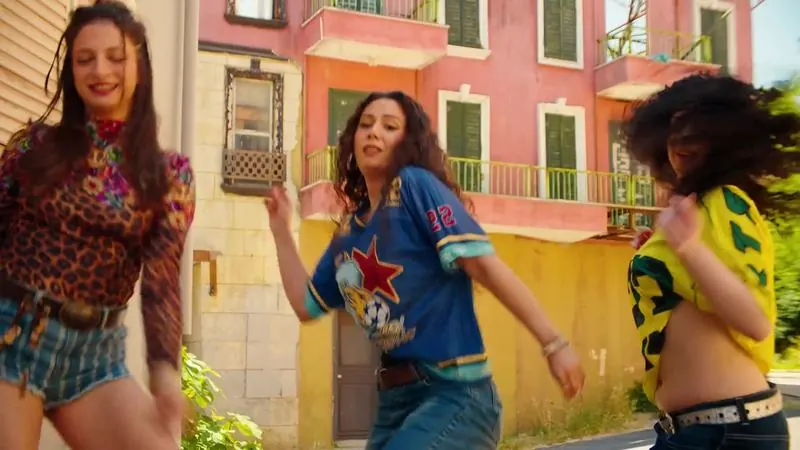 Dancers in colourful outfits on a sunny Istanbul street